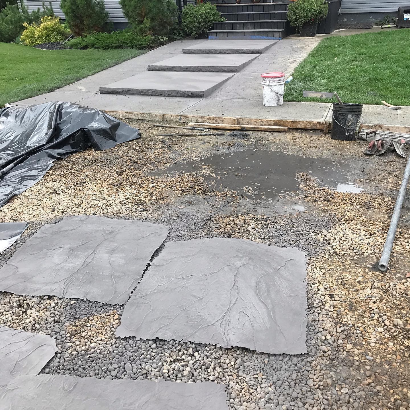 Concrete crew working during an earlier stage